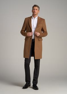 About Our Extra-Long Wool Coat Timeless, stylish and built for your frame. This tall men's coat is essential in every guy's wardrobe, a staple piece that will instantly elevate any outfit while keeping you warm. Every seam has been measured specifically for men between 6'3” and 7'1”, with extra-long sleeves that will cover your tall guy arms and a mid-thigh length that will actually end where it's supposed to. The clean lines of this coat for tall men provide a polished look while the notch lape Mens Dress Coats Winter, Business Camel Outerwear With Lapel Collar, Camel Business Outerwear With Lapel Collar, Modern Brown Outerwear For Business, Modern Brown Business Outerwear, Classic Camel Outerwear For Formal Occasions, Formal Camel Winter Outerwear, Camel Winter Formal Outerwear, Camel Formal Winter Outerwear