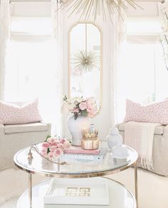 a living room filled with furniture and flowers