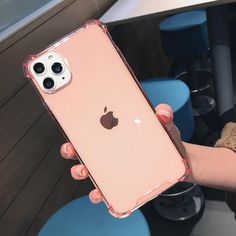 a person holding an iphone case in their hand