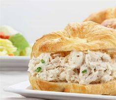 a chicken salad sandwich on a white plate