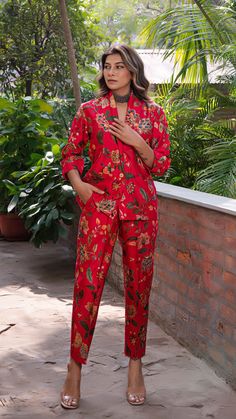 Make heads turn with out printed co-ord set in silk. Straight Pants with Blazer Jacket. Made in printed raw silk. Color : Red. Fully lined. No of Components : 2. Model height is 5.6” and is wearing a size S. Wash Care : Dry Clean Only. Festive Silk Pant Set With Printed Motifs, Raw Silk Co Ord Sets, Printed Satin Coord Sets, Satin Print Coord Set, Floral Print Co Ord Set, Co Ord Set, Co Ord, Print Jacket, Pakistani Outfits