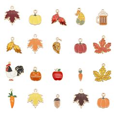 a bunch of charms that are all different colors and designs on each one, including apples, pumpkins, leaves, acornies, and more