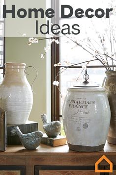 some vases sitting on top of a wooden table next to a window with the words home decor ideas