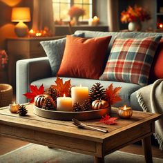 a living room filled with lots of furniture and candles on top of a coffee table