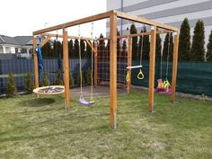 an outdoor play area with swings and toys