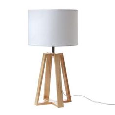 a wooden table lamp with a white shade on the base and a cord plugged into it