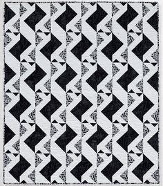 a black and white rug with an abstract design