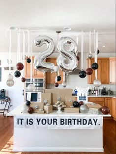 a birthday party with balloons and decorations in the shape of two twenty - fives