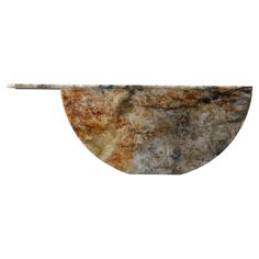 a piece of marble is shown on a white background with an oval shaped object in the middle