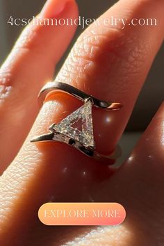 a woman's hand with a diamond ring on top of her finger and the words explore more below