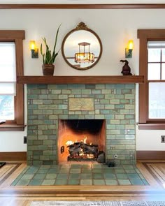 a fireplace with a mirror above it and some plants on the top shelf over it