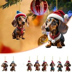 a christmas ornament with two dachshunds hanging from it's sides