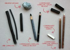 an assortment of different types of pens and pencils on a sheet of white paper