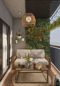 a living room with couches, tables and plants on the wall in front of it