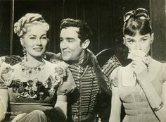 an old black and white photo of three people