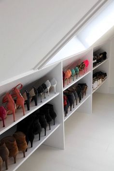 there are many pairs of shoes on the shelves