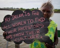 a woman holding up a sign that says, my dream is for all women to find their ancestors and know their culture