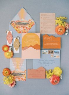 the wedding stationery was done in peach, yellow and blue with an orange theme