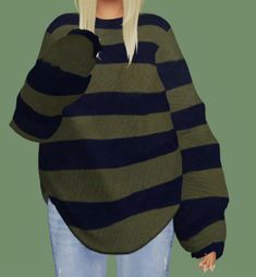 a woman with blonde hair wearing a green and black striped sweater