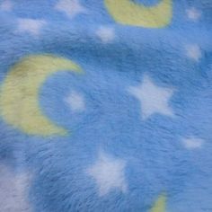 a blue and yellow blanket with stars on it