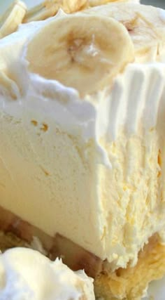 a banana cream pie with whipped cream and sliced bananas on top, ready to be eaten