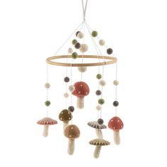 a wind chime with mushrooms hanging from it