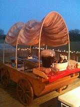 an old fashioned wagon with food on it