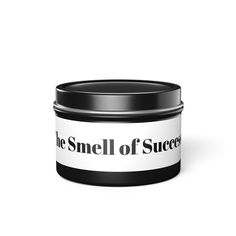 a black and white tin with the smell of success written on it