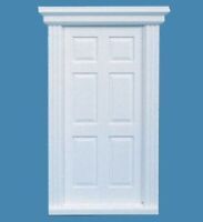 a white door on a blue background with the top half painted white and the bottom half painted black