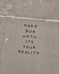 graffiti written on the ground that says make dua until it's your reality