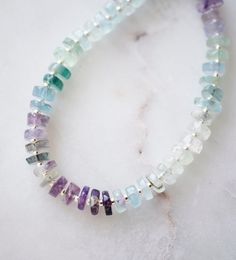 Fluorite is said to absorb and neutralize negative energy & stress. It is also believed to increase concentration, self-confidence, and help in decision-making. This bracelet is handcrafted with genuine Fluorite ranging blues, greens, and purples. Each stone is slightly different in width and has a tiny gold or silver bead between. STONE SIZE: 6mm SIZING: Please measure your wrist to find your size before purchasing. If purchasing as a gift the adjustable size of 6.5 to 7.5" fits most average wo Fusion Style Healing Bracelets With Gemstone Beads, Minimalist Gemstone Beads Crystal Bracelet For Healing, Minimalist Crystal Bracelet With Gemstone Beads For Healing, Fluorite Natural Stone Beaded Bracelets As Gift, Spiritual Fluorite Bracelets With Gemstone Beads, Spiritual Fluorite Bracelets With Natural Stones, Healing Gemstone Beads Bracelet, Rondelle Natural Stone Bracelets For Healing, Fusion Style Gemstone Beaded Bracelets For Healing