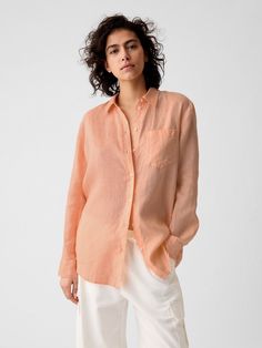 Soft linen shirt.  Spread collar.  Long sleeves with button cuffs.  Button front.  Patch pocket at chest.  Certain styles have allover prints.  * Fit: Relaxed.  A straight & easy fit.  * Style Note: For a more Classic fit, go down one Peach Outfits For Women, Gap Linen Shirt With Relaxed Fit, Gap Relaxed Fit Linen Shirt, Peach Shirt Outfit, Gap Linen Button-up Shirt, Flax Colored Relaxed Fit Button-up Shirt, Pink Linen Long Sleeve Shirt, Long Sleeve Shirt Outfits, Cherry Shirt