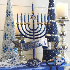 a hanukkah menorah with blue and silver decorations