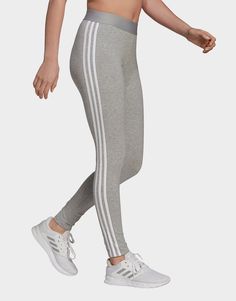 Clean, minimalist design inspires this everyday essential. Contrast 3-Stripes and a logo keep these women adidas leggings rooted in simple sporty style. Stretchy cotton makes them feel soft and comfortable.• Regular fit• 93% cotton, 7% elastane• 3-Stripes leggings Adidas 3 Stripes, Adidas Grey, Adidas Leggings, Timeless Wardrobe Staples, Striped Leggings, Grey Adidas, Jd Sports, Sporty Style, Adidas Women