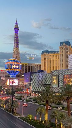 the eiffel tower in las vegas is lit up at night