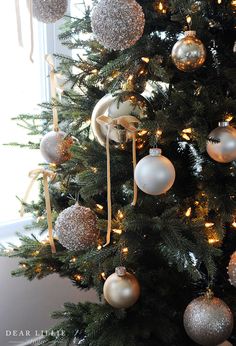 a christmas tree with ornaments hanging from it