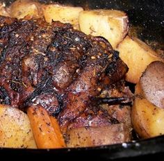 a close up of some meat and potatoes