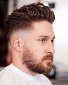 Men's sleek pompadour hairstyle with low skin fade. This hairstyle first appeared in the article: Low Fade Haircuts Guide: 18 Cool Styles For 2022, on MensFlair.com Medium Skin Fade, Faded Haircut, Mid Skin Fade, Mid Fade Haircut, Men Hairstyle, Mens Hairstyles Medium, Long Hair On Top