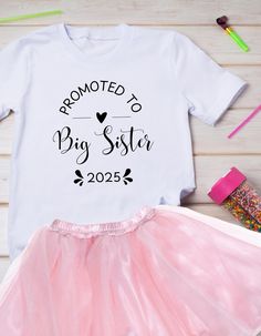 This Promoted to Big Sister Tee 2025 is perfect for the newest big sister in your family. Made from soft and durable fabric, this tee is ideal for everyday wear and celebrating the arrival of a new family member. A great gift for a young girl transitioning into her new role as a big sister. Product features - Fabric: Strong and smooth fabric, perfect for printing - With side seams for structural support - Ribbed knit collar for elasticity and shape retention - Fiber composition varies by color - Shoulder tape for stabilization - Light fabric and classic fit - Runs true to size Care instructions - Machine wash: cold (max 30C or 90F) - Non-chlorine: bleach as needed - Tumble dry: low heat - Iron, steam or dry: low heat - Do not dry clean Sibling Pregnancy Reveal, Sister Announcement, Big Sister Announcement, Promoted To Big Sister, Big Sister Shirt, Pregnancy Reveal, Sister Shirts, Pregnancy Reveals, Big Sister