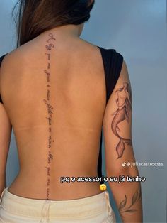 the back of a woman's body with writing on it