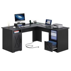 a computer desk with two computers on top of it and a book shelf underneath the desk