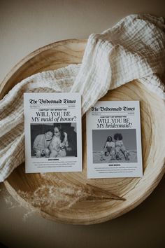 two books are sitting on a wooden plate