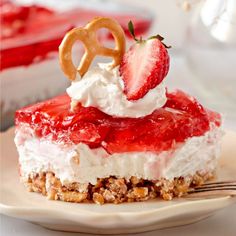 a dessert with strawberries and whipped cream on top