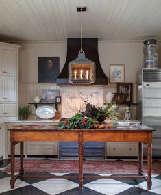 a kitchen with an island in the middle of it