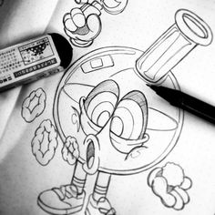 an image of a cartoon character drawn on paper with markers and markers next to it