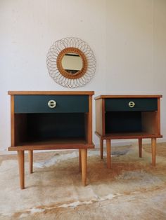 two wooden nightstands sitting next to each other on top of a carpeted floor