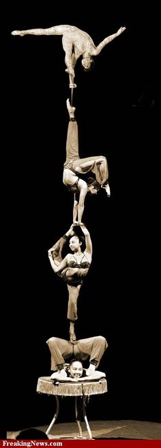 three acrobatic acrobatics are doing tricks on a table top