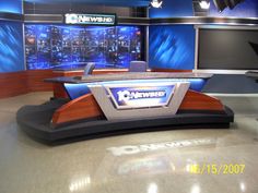 the news studio is set up for an evening newscast