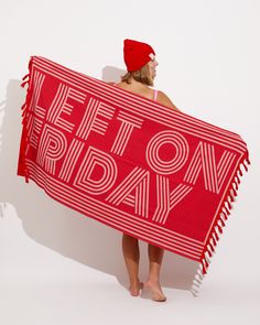 a woman holding a red towel with the words left on friday