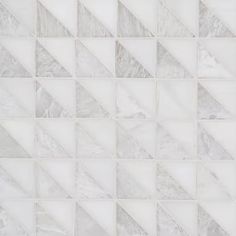 a white marble mosaic tile wallpaper with grey and white geometric designs on the edges